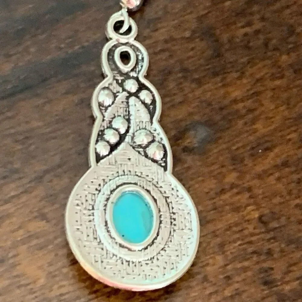 The Mavi Turquoise Blue Dangle Earrings in Silver Tone